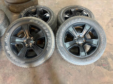 Load image into Gallery viewer, Set of Used Black '19-'25 Dodge RAM 1500 OEM Wheels on 275/55R20 Bridgestone LT