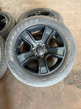 Load image into Gallery viewer, Set of Used Black '19-'25 Dodge RAM 1500 OEM Wheels on 275/55R20 Bridgestone LT
