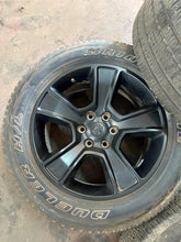 Load image into Gallery viewer, Set of Used Black '19-'25 Dodge RAM 1500 OEM Wheels on 275/55R20 Bridgestone LT