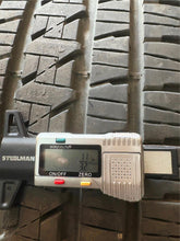 Load image into Gallery viewer, Set of Used Black '19-'25 Dodge RAM 1500 OEM Wheels on 275/55R20 Bridgestone LT