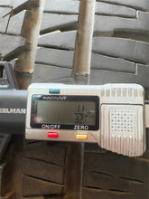 Load image into Gallery viewer, Set of Used Black '19-'25 Dodge RAM 1500 OEM Wheels on 275/55R20 Bridgestone LT