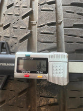 Load image into Gallery viewer, Set of Used Black '19-'25 Dodge RAM 1500 OEM Wheels on 275/55R20 Bridgestone LT