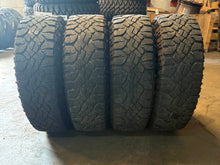 Load image into Gallery viewer, Set of Used '19-'25 RAM 1500 Black Rims 275/70R18 Goodyear Wrangler Duratrac LT