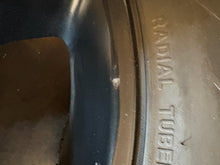 Load image into Gallery viewer, Set of 4 Used Black '19-'25 Dodge RAM 1500 OEM Wheels 275/55R20 Ironman Tires LT