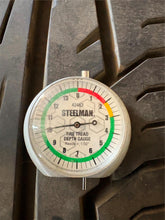 Load image into Gallery viewer, Set of 4 Used Black '19-'25 Dodge RAM 1500 OEM Wheels 275/55R20 Ironman Tires LT