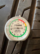 Load image into Gallery viewer, Set of 4 Used Black '19-'25 Dodge RAM 1500 OEM Wheels 275/55R20 Ironman Tires LT