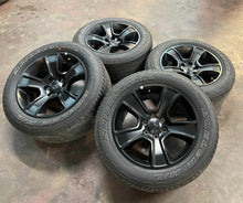 Load image into Gallery viewer, Used Set of 4 OEM 20" Black '19-'25 RAM 1500 Rims on 275/55R20 Bridgestone HL LT