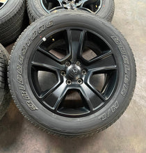 Load image into Gallery viewer, Used Set of 4 OEM 20" Black '19-'25 RAM 1500 Rims on 275/55R20 Bridgestone HL LT