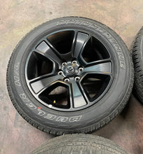 Load image into Gallery viewer, Used Set of 4 OEM 20" Black '19-'25 RAM 1500 Rims on 275/55R20 Bridgestone HL LT