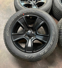 Load image into Gallery viewer, Used Set of 4 OEM 20" Black '19-'25 RAM 1500 Rims on 275/55R20 Bridgestone HL LT