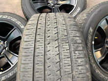 Load image into Gallery viewer, Used Set of 4 OEM 20" Black '19-'25 RAM 1500 Rims on 275/55R20 Bridgestone HL LT