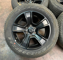 Load image into Gallery viewer, Used Set of Four OEM 20" Black '19-'25 RAM 1500 Wheels 275/55R20 Bridgestone LT