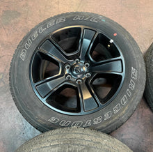 Load image into Gallery viewer, Used Set of Four OEM 20" Black '19-'25 RAM 1500 Wheels 275/55R20 Bridgestone LT