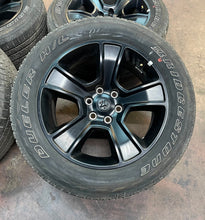 Load image into Gallery viewer, Used Set of Four OEM 20" Black '19-'25 RAM 1500 Wheels 275/55R20 Bridgestone LT
