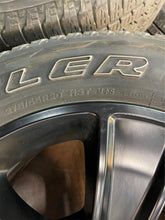 Load image into Gallery viewer, Used Set of Four OEM 20" Black '19-'25 RAM 1500 Wheels 275/55R20 Bridgestone LT