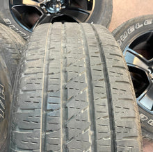 Load image into Gallery viewer, Used Set of Four OEM 20" Black '19-'25 RAM 1500 Wheels 275/55R20 Bridgestone LT