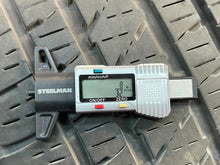 Load image into Gallery viewer, Used Set of Four OEM 20" Black '19-'25 RAM 1500 Wheels 275/55R20 Bridgestone LT