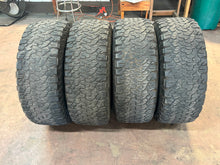 Load image into Gallery viewer, Set of Used OEM '05-'25 Ford F150 Raptor Wheels on 315/70R17 BFGoodrich TAKO2 LT