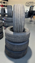 Load image into Gallery viewer, Set of Four OEM Black '19-'26 RAM 1500 Wheels 275/55R20 Bridgestone Alenza Tires