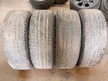 Load image into Gallery viewer, Set of Used 20" Black '19-'26 RAM 1500 2676 Wheels 275/55R20 Bridgestone H/L LT
