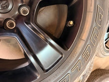 Load image into Gallery viewer, Set of Used 20" Black '19-'26 RAM 1500 2676 Wheels 275/55R20 Bridgestone H/L LT