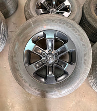 Load image into Gallery viewer, Set of 4 Used 2672 18" Black '19-'26 RAM 1500 Wheels 275/65R18 Goodyear Tires LT