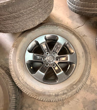Load image into Gallery viewer, Set of 4 Used 2672 18" Black '19-'26 RAM 1500 Wheels 275/65R18 Goodyear Tires LT