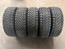 Load image into Gallery viewer, Set of 5 Used '22-'26 INEOS Grenadier 18" Rims on 255/70R18 BFGoodrich TAKO2 LT