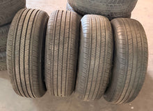 Load image into Gallery viewer, Lightly Used Set of '24-'26 Toyota Tacoma 17" OEM Rims 245/70R17 Goodyear HT LT