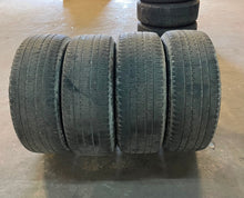Load image into Gallery viewer, Set of 4 Used '19-'26 RAM 1500 Black OEM Wheels 275/55R20 Bridgestone H/L OWL LT