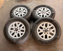 Load image into Gallery viewer, Lightly Used Set of '24-'26 Toyota Tacoma 17" OEM Rims 245/70R17 Goodyear HT LT