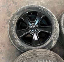 Load image into Gallery viewer, Set of 4 Used '19-'26 RAM 1500 Black OEM Wheels 275/55R20 Bridgestone H/L OWL LT