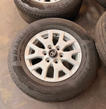 Load image into Gallery viewer, Lightly Used Set of '24-'26 Toyota Tacoma 17" OEM Rims 245/70R17 Goodyear HT LT