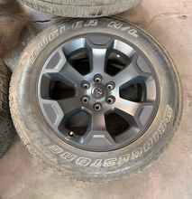 Load image into Gallery viewer, Set of Used 20" '19-'26 RAM 1500 2462 Black Clad Wheels 275/55R20 Bridgestone LT
