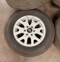 Load image into Gallery viewer, Set of New Takeoff '24-'26 Toyota Tacoma 17" OEM Wheels on 245/70R17 Toyo HT LT

