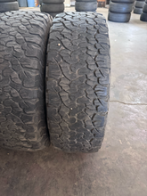 Load image into Gallery viewer, OEM '07-'26 Jeep Wrangler 17" Black Used Rims 285/70R17 BFGoodrich AT Tires LT
