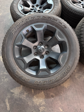 Load image into Gallery viewer, OEM '19-'26 RAM 1500 20" Matte Black Used Wheels on 275/55R20 Bridgestone HL LT
