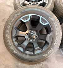 Load image into Gallery viewer, Set of OEM Used '19-'26 RAM 1500 Black Clad Wheels 275/55R20 Bridgestone H/L LT
