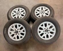 Load image into Gallery viewer, Set of New Takeoff '24-'26 Toyota Tacoma 17" OEM Wheels on 245/70R17 Toyo HT LT
