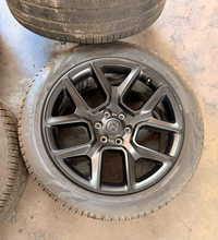 Load image into Gallery viewer, Set of 4 Used Black '19-'26 RAM 1500 22" Wheels 285/45R22 Pirelli All Season LT
