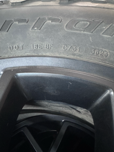 Load image into Gallery viewer, OEM '07-'26 Jeep Wrangler 17" Black Used Rims 285/70R17 BFGoodrich AT Tires LT
