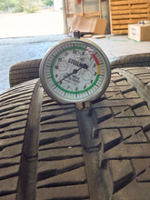 Load image into Gallery viewer, Set of Used 20" Matte Black '19-'26 RAM 1500 OEM Wheels 275/55R20 Bridgestone LT
