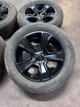 Load image into Gallery viewer, OEM '19-'26 RAM 1500 OEM Black Used Wheels on 275/55R20 Bridgestone HL Tires LT
