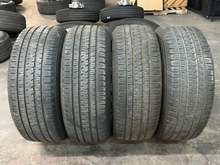 Load image into Gallery viewer, Set of 4 Used '19-'26 RAM 1500 Black 2723 Wheels 275/55R20 Bridgestone Alenza LT
