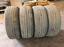 Load image into Gallery viewer, Set of Used '19-'26 RAM 1500 Black Clad Wheels on 275/55R20 Bridgestone Tires LT
