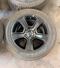Load image into Gallery viewer, Set of Used Black '19-'26 RAM 1500 OEM Wheels 275/55R20 Bridgestone HL Tires LT
