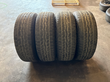 Load image into Gallery viewer, OEM '22-'26 Toyota Tundra Black TRD 20" Used Wheels on 265/60R20 Falken AT3WA LT
