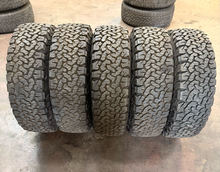 Load image into Gallery viewer, Set of 5 Lightly Used 18" INEOS Grenadier OEM Wheels 255/70R18 BFGoodrich AT LT
