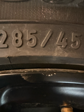 Load image into Gallery viewer, Set of 4 Used OEM 22" '19-'26 RAM 1500 Black Rims 285/45R22 Pirelli Scorpion LT
