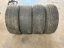 Load image into Gallery viewer, Set of 4 Used '19-'26 RAM 1500 20" OEM Wheels on 275/55R20 Falken Wildpeak AT LT

